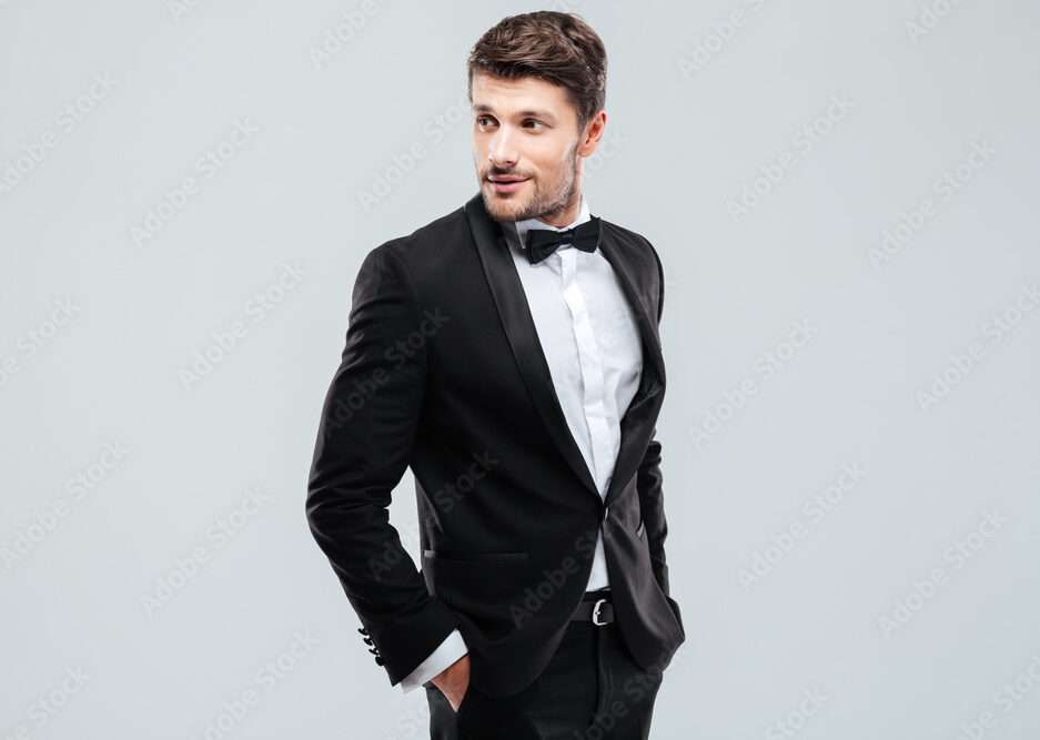 How to Choose the Perfect Stylish Wedding Tux for Your Big Day Attractive young man in tuxedo and bowtie