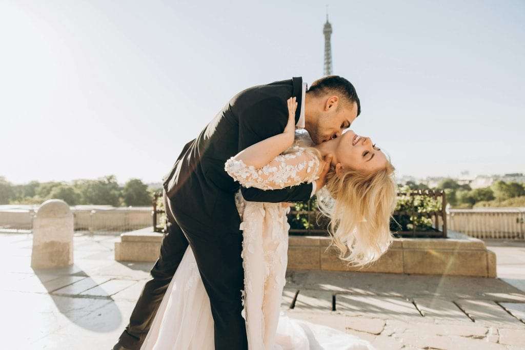 groom-kissing-bride-neck-stockpack-pexels | WEDISTRY BLOG bride guide